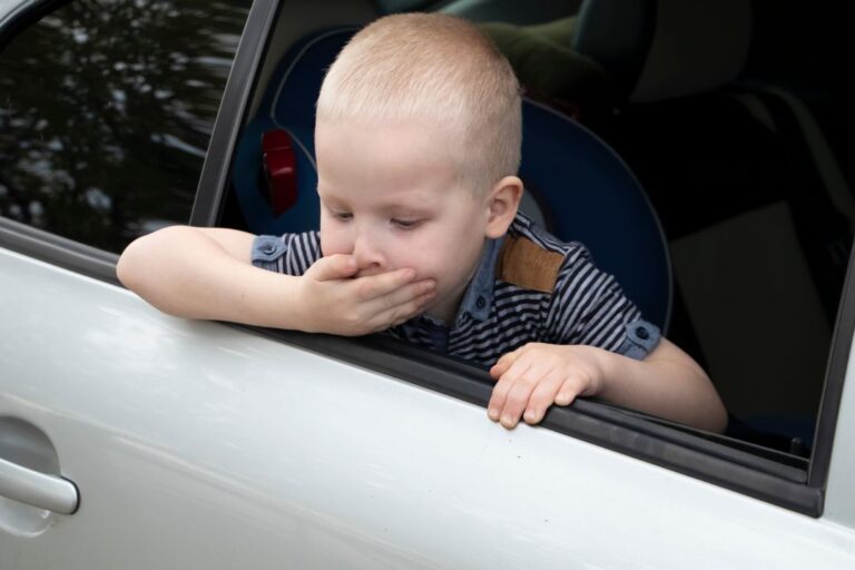 A kid Dealing With Car Sickness